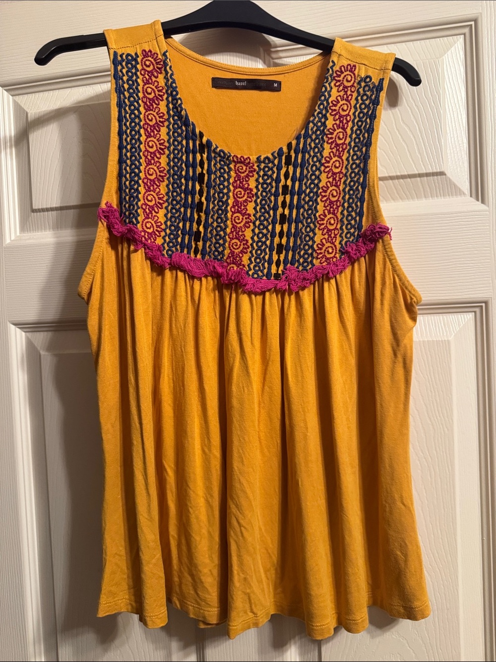 hazel Mustard Sleeveless Tank with Navy Embroidered Bib and Pink Fringe